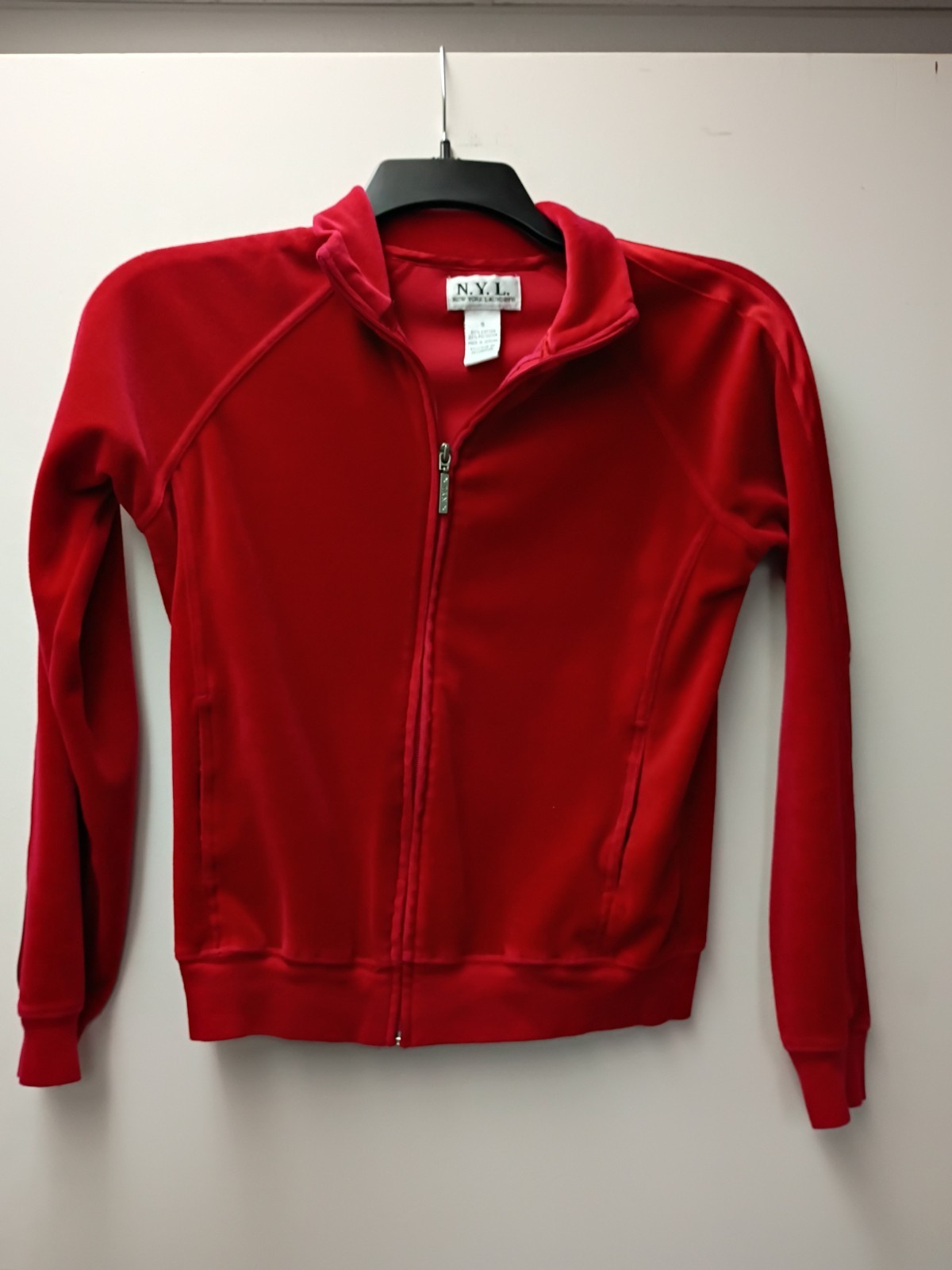 red N.Y.L. Small Woman’s full-zip jacket features a stand-up collar 17×22